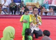 Pj Bupati Takalar Sosialisasi Gemar Makan Ikan dan Market Day di Hari Anak Nasional 